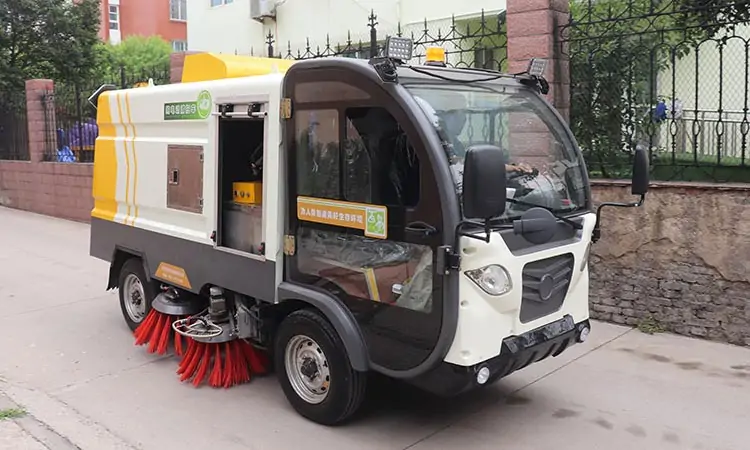 Electric sweeper sweeps the road
