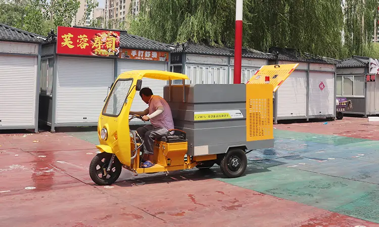 Small Three-wheeled Road Cleaning Vehicle Washes Commercial Pedestrian Streets