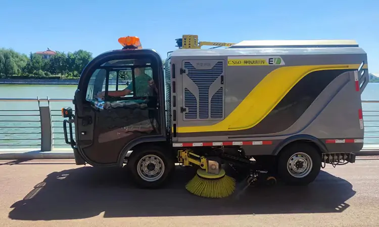 The Small Electric Street Sweeper Works In Seaside City Park