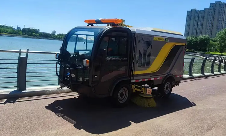 The Small Electric Street Sweeper Works In Seaside City Park