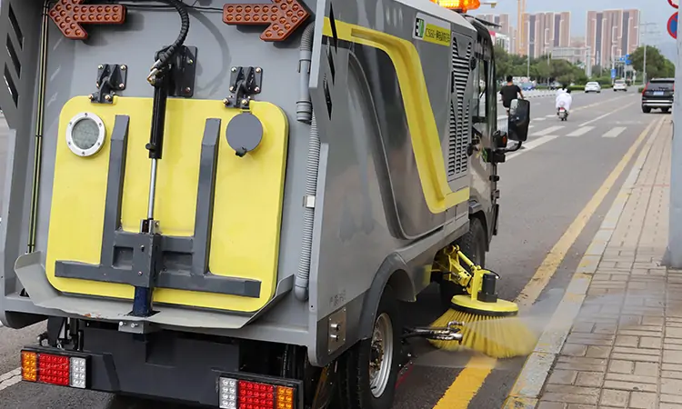Why do street sweepers spray water?