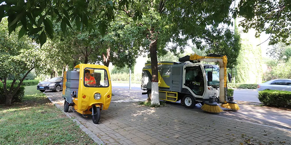 Leaf Collection Trucks Work in Conjunction with Electric Street Washer