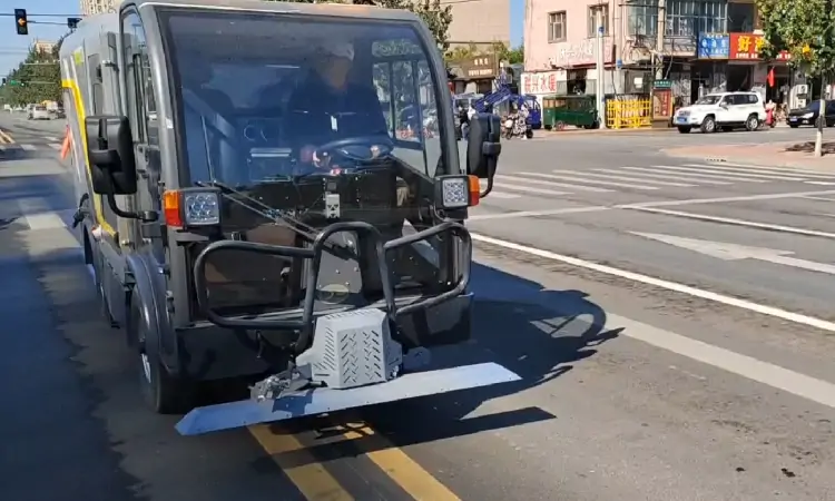 Electric deep cleaning vehicle is cleaning road markings at the customer's site