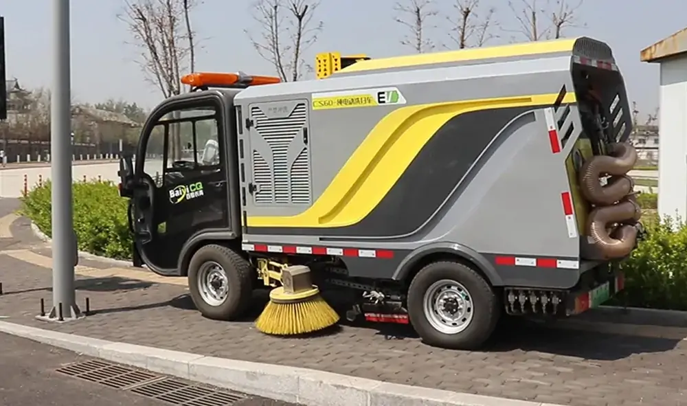 Small Electric Street Sweeper Is Used For Cleaning And Maintenance In A Park