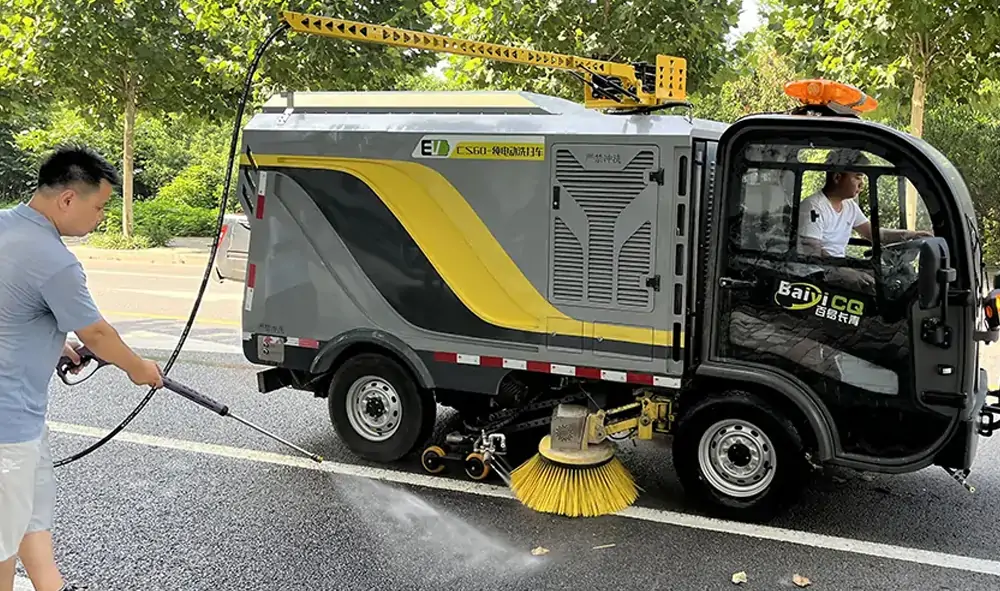 Small Electric Street Sweeper Is Used For Cleaning And Maintenance In A Park